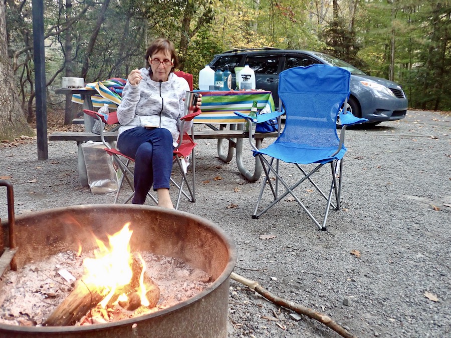 camper enjoying campfire