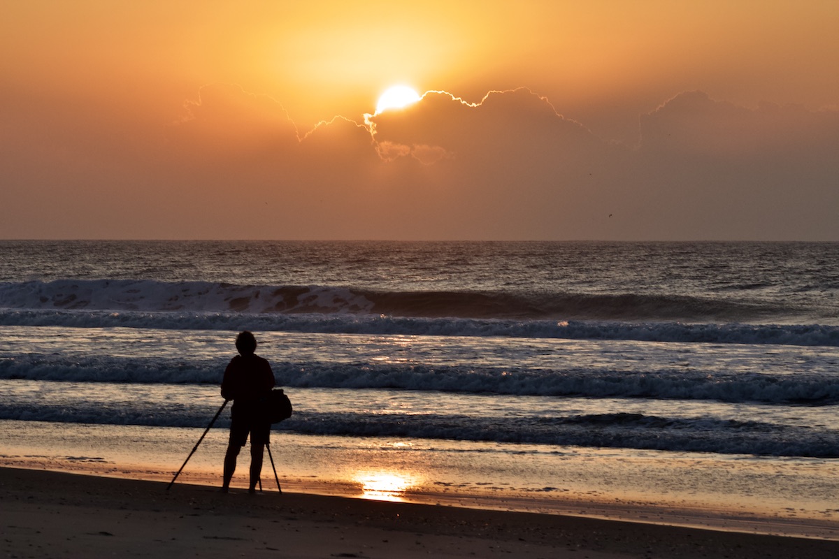 Photographer at sunrise, Okracoke Island.