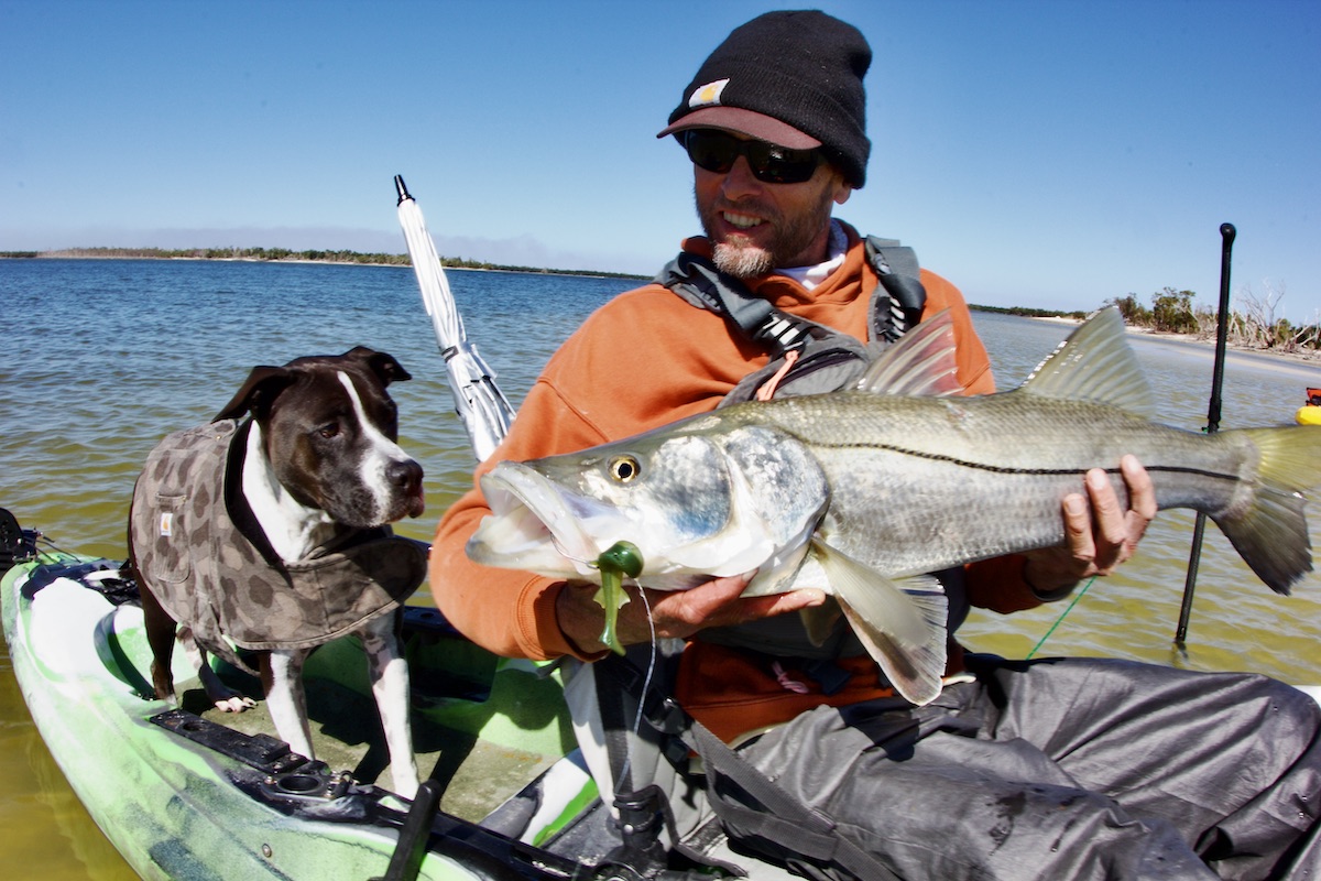 dog and man with big snook