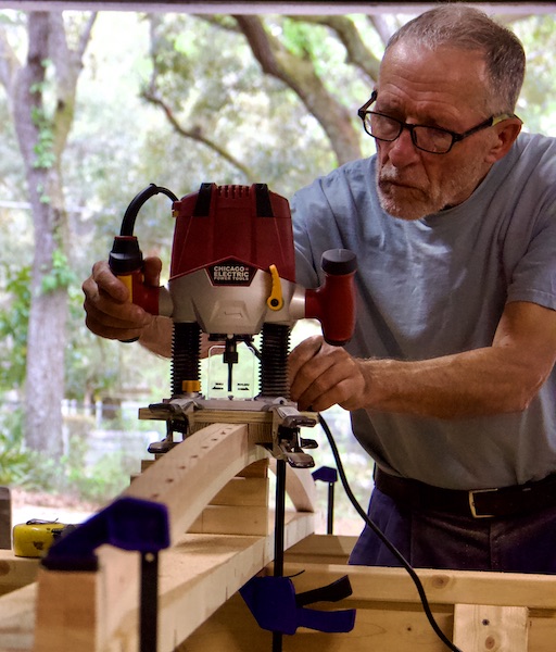 man using plunge router