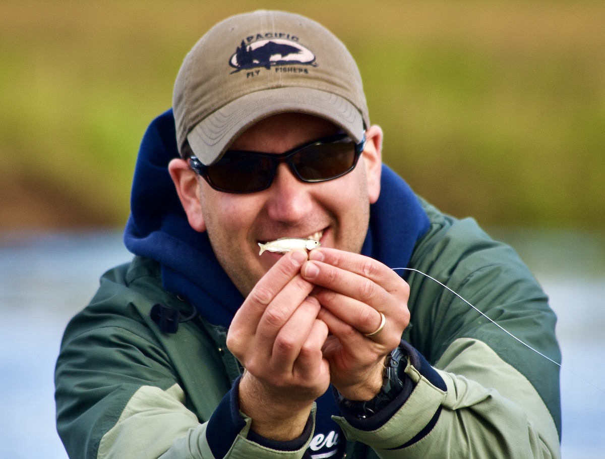 man with tiny fish