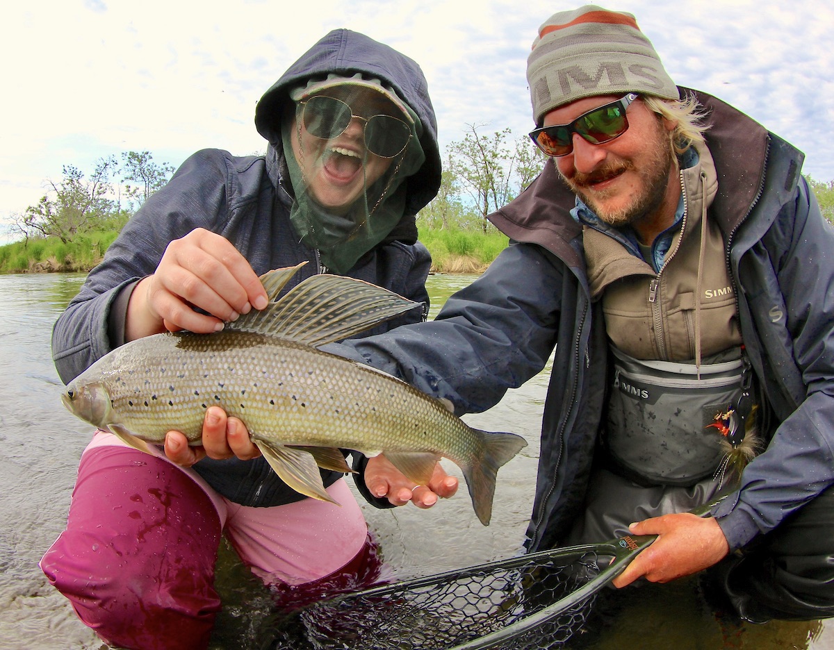 happy girl with grayling