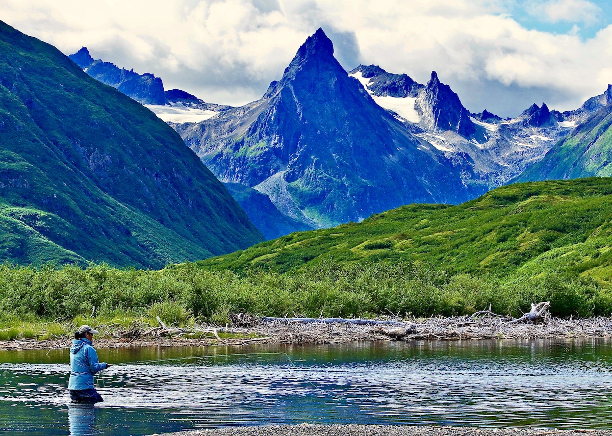 woman fly fishing in Alaska