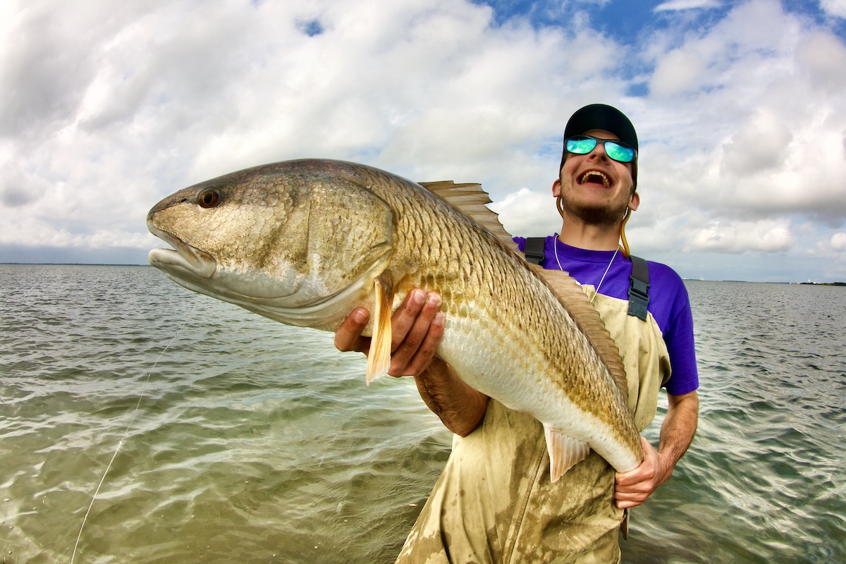 man with big redfish