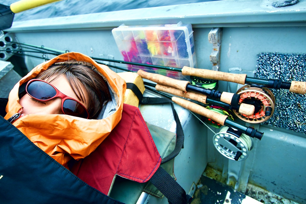 boy sleeping in boat