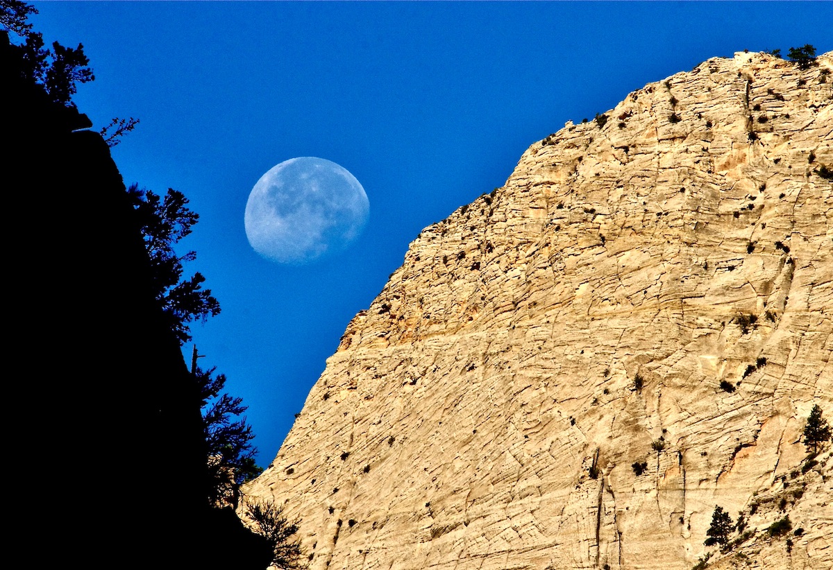 moon in sky over zion national park