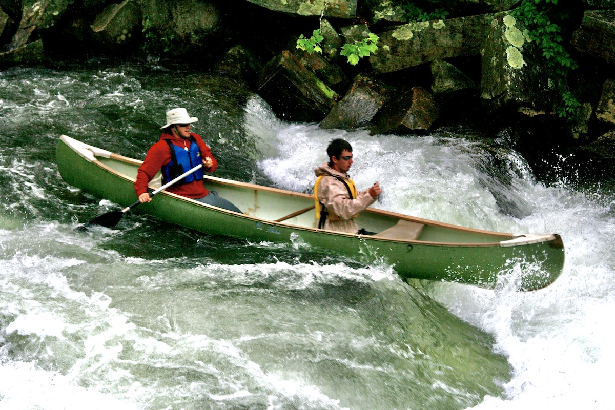 canoeists in a rapid