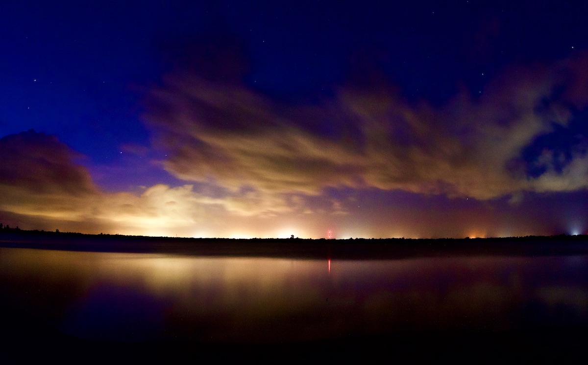 city lights at night reflected by water